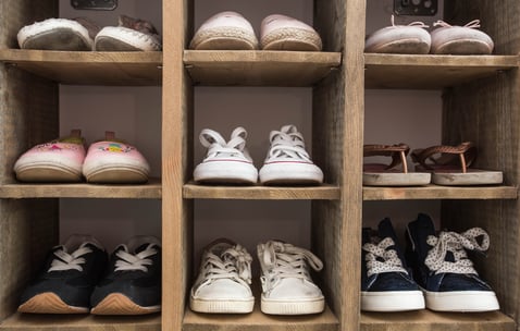 Dirty Shoes on Rack at Home